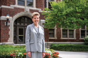 Linda Martin standing in front of Morgan Hall