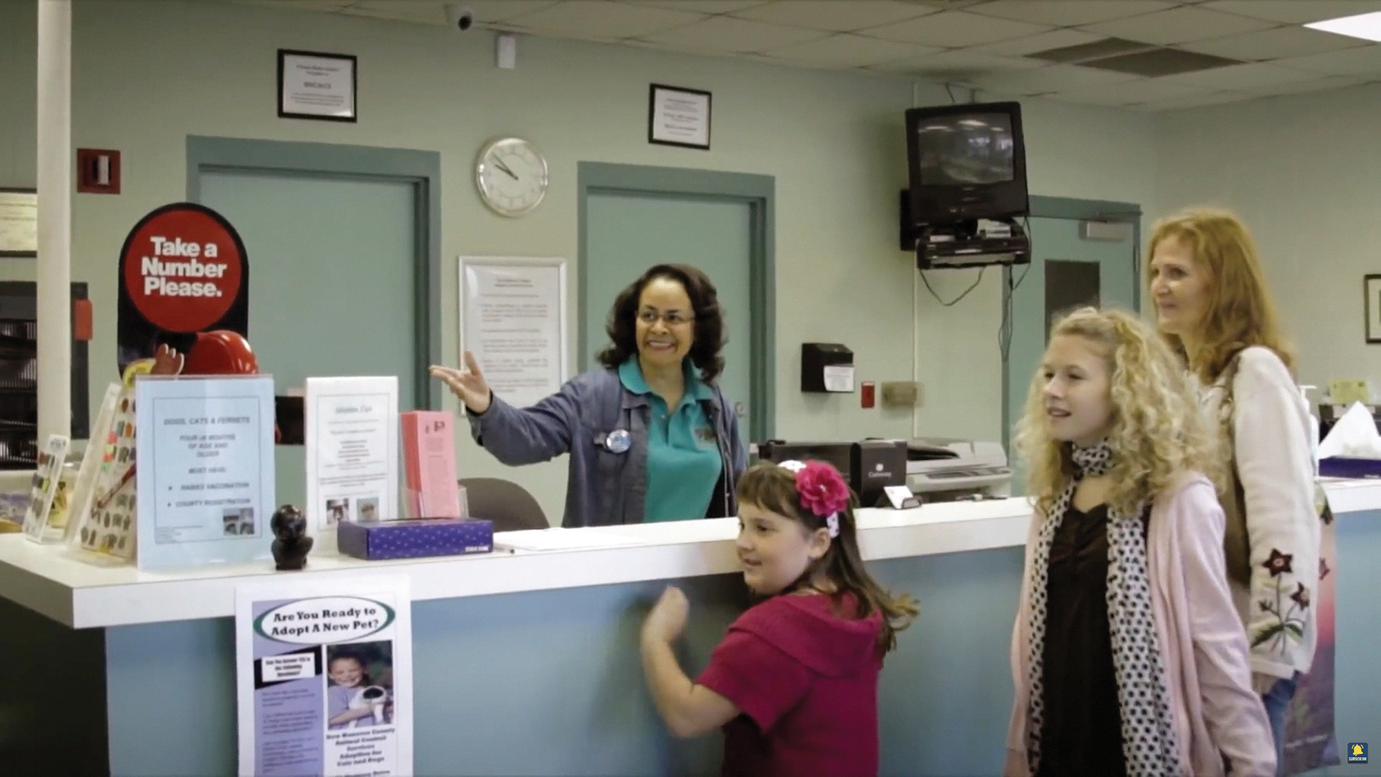 Jean Proctor McNeil showing people where to go in an office