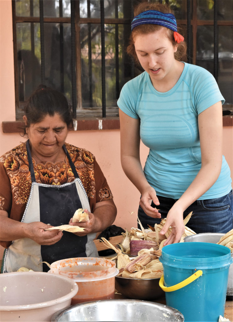 Student cooking with a woman from Kemajachel in Guatemala