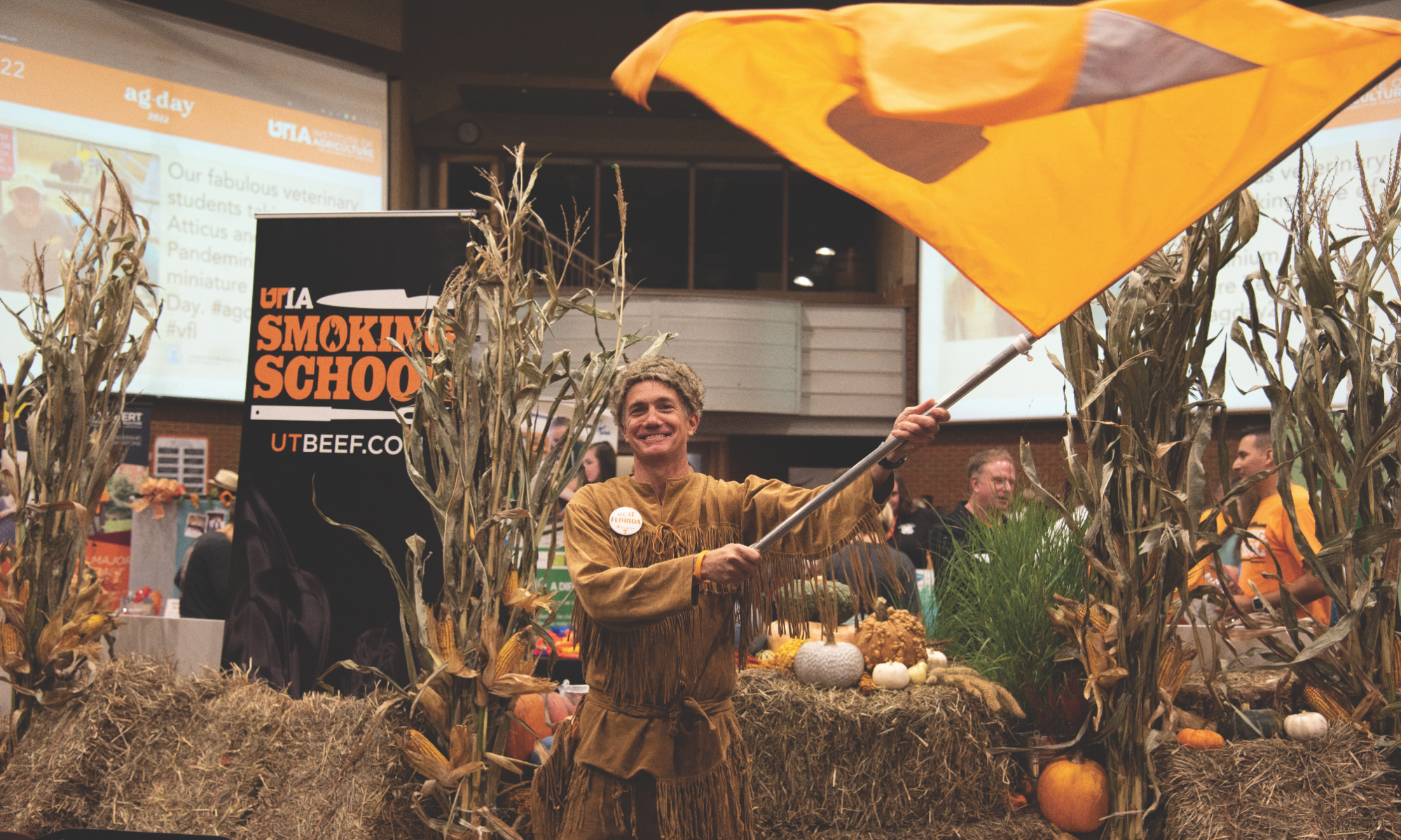 Tom Looney dressed as a Volunteer waving a UT flag