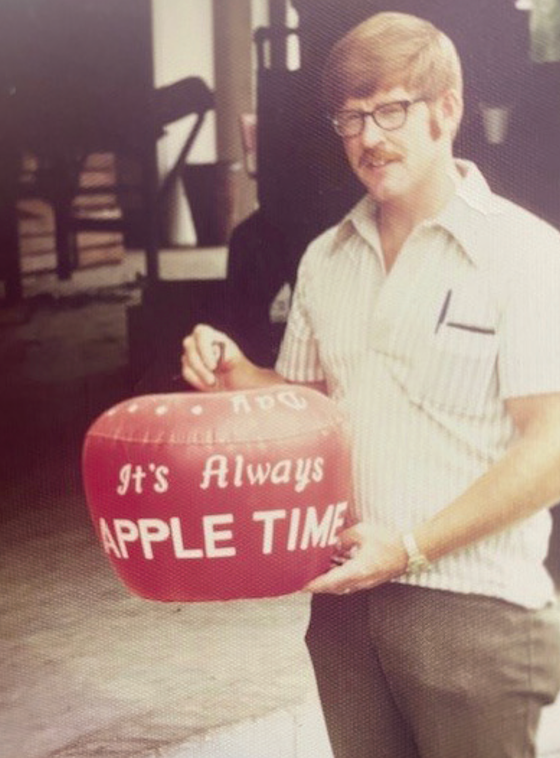 David Lockwood in earlier years posing with an apple sign.