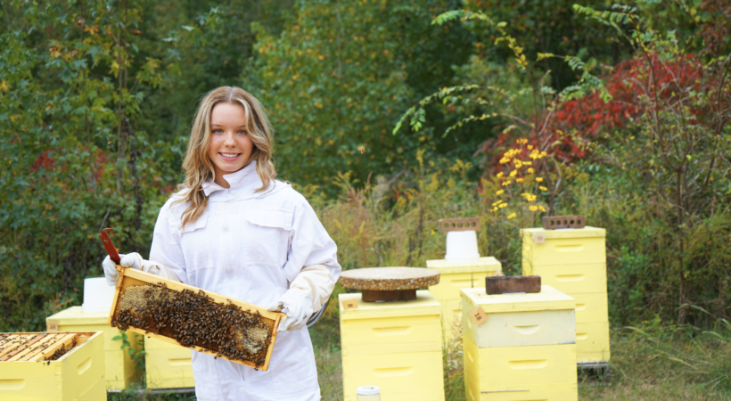 Paige Costello with her multiple bee hives
