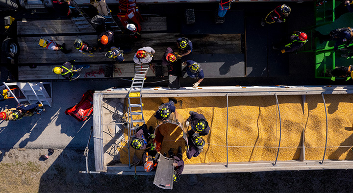 First responders doing a safety demonstration in a grain bin