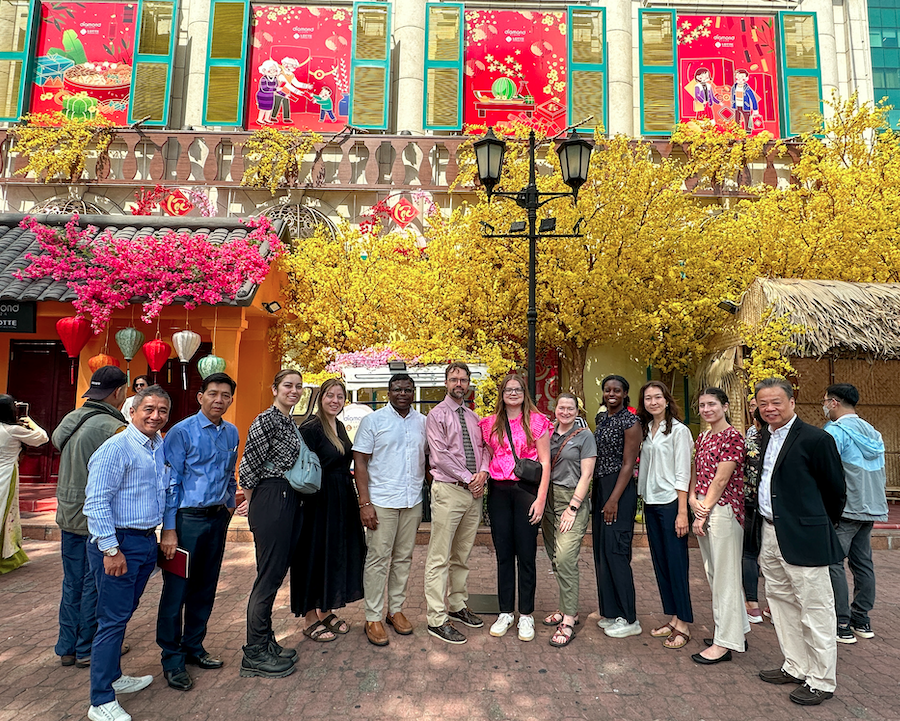 Students under a bright yellow tree