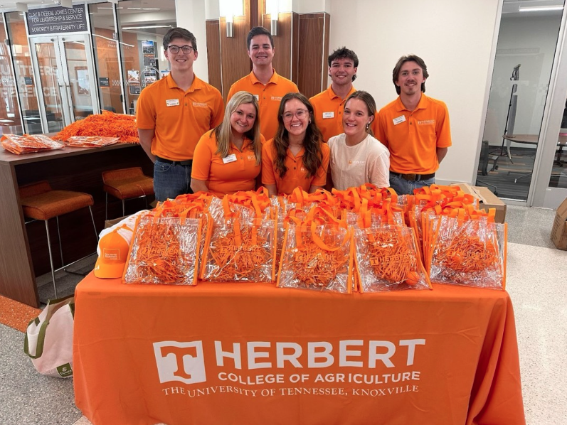 Students at a table representing the Herbert College of Agriculture