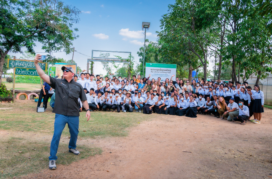 Keith Carver taking a selfie with a group of students