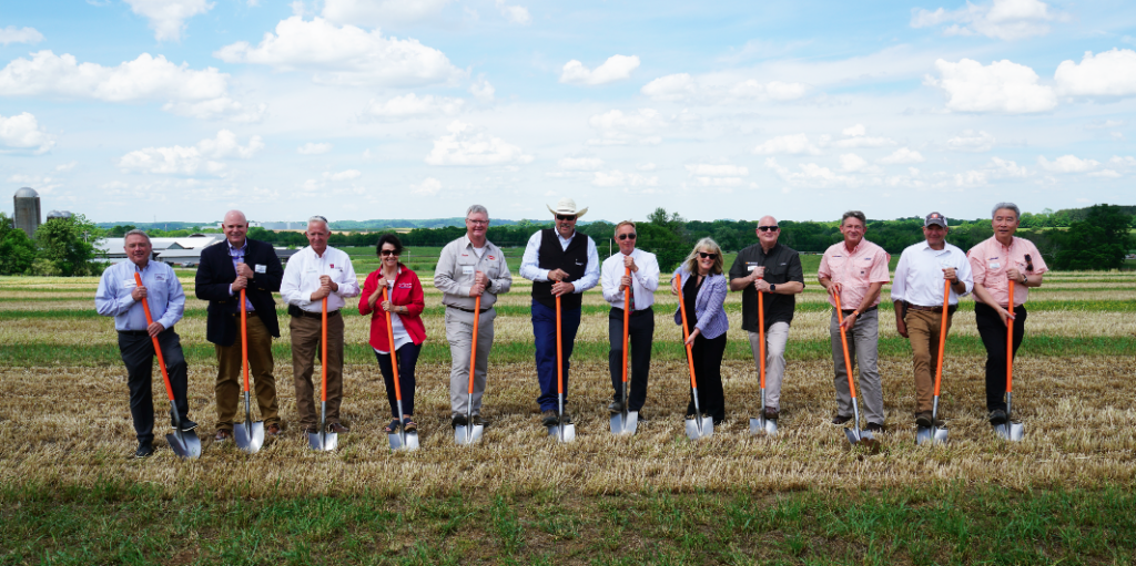 Groundbreaking ceremony leaders holding shovels