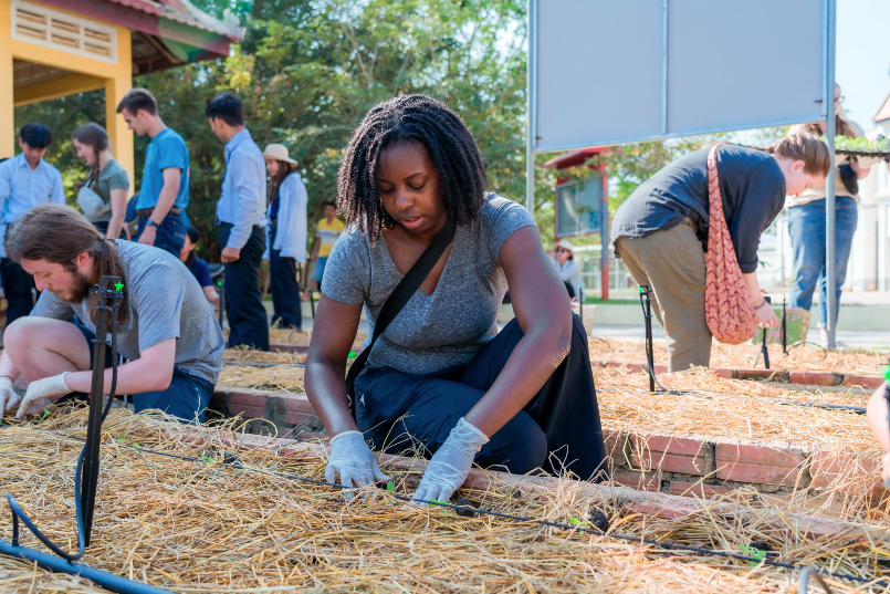 Students spreading mulch