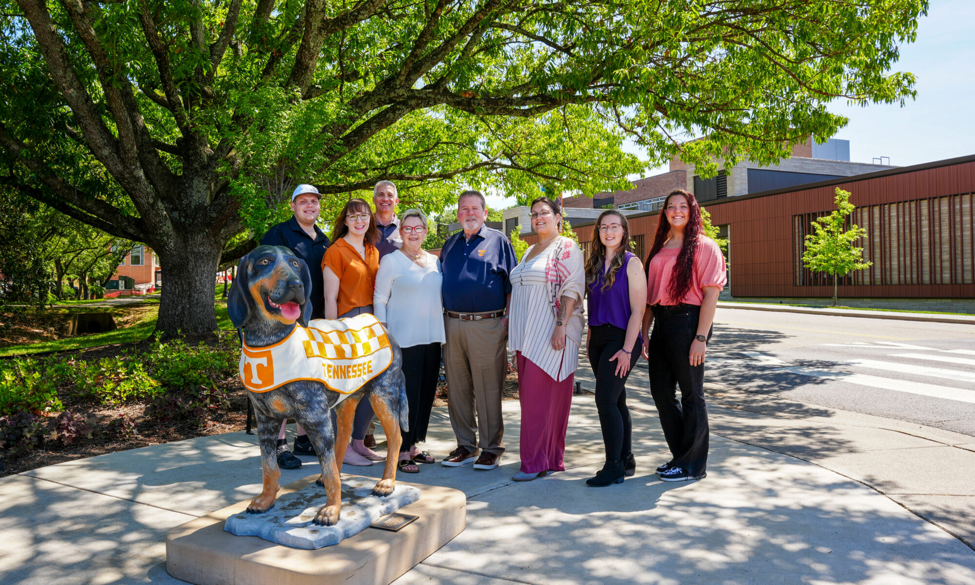 A group standing with the Smokey Statue