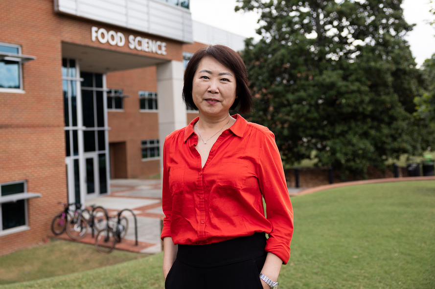 Toni Wang standing in front of the Food Science Building