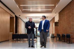Keith Carver and Paul Plummer walking the halls of the new Teaching and Learning Center