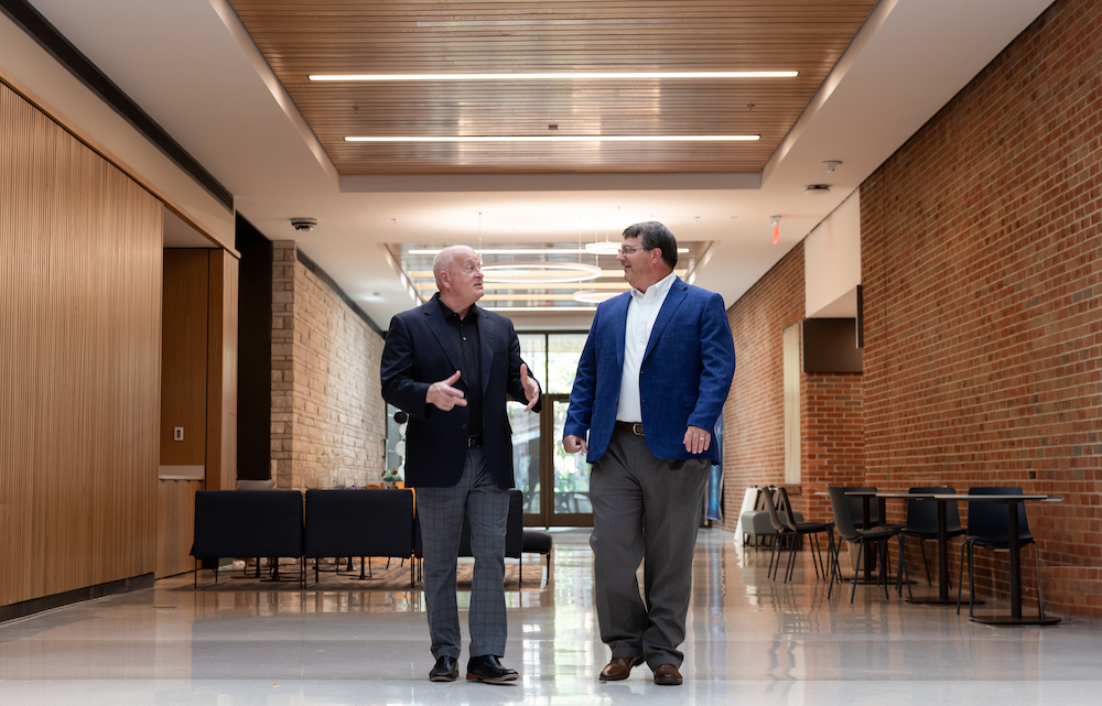 Keith Carver and Paul Plummer walking the halls of the new Teaching and Learning Center