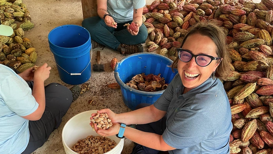 Denita sorting through cacao pods