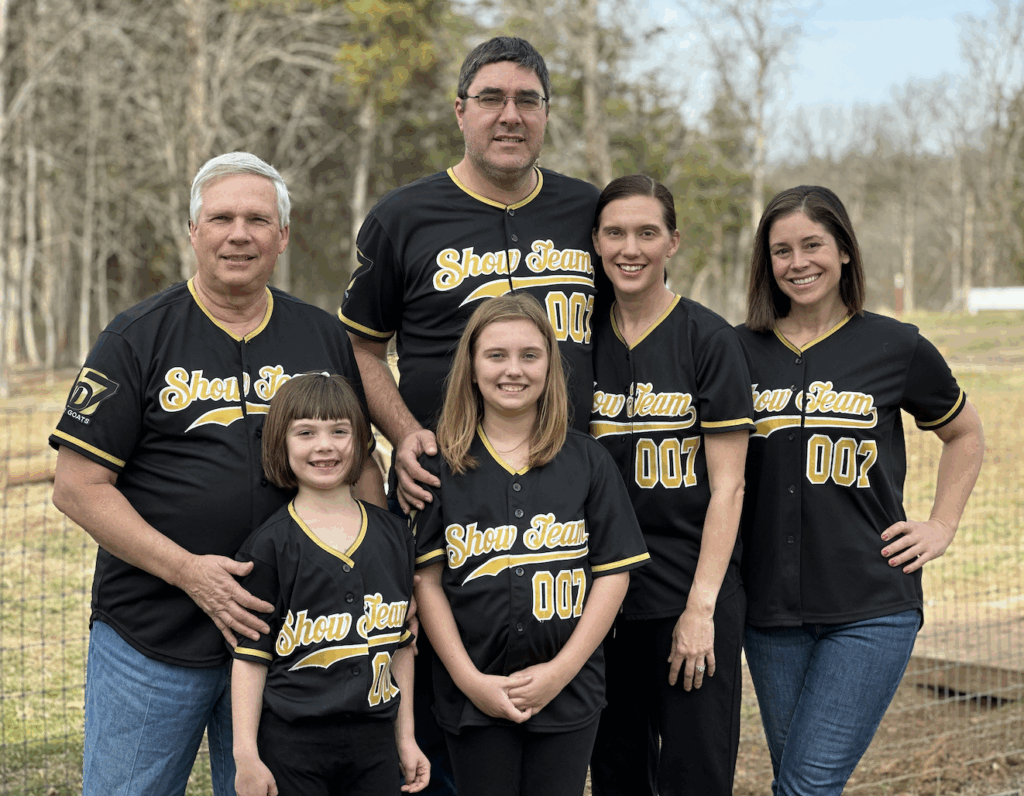 Mobley family group photo wearing matching show team uniforms