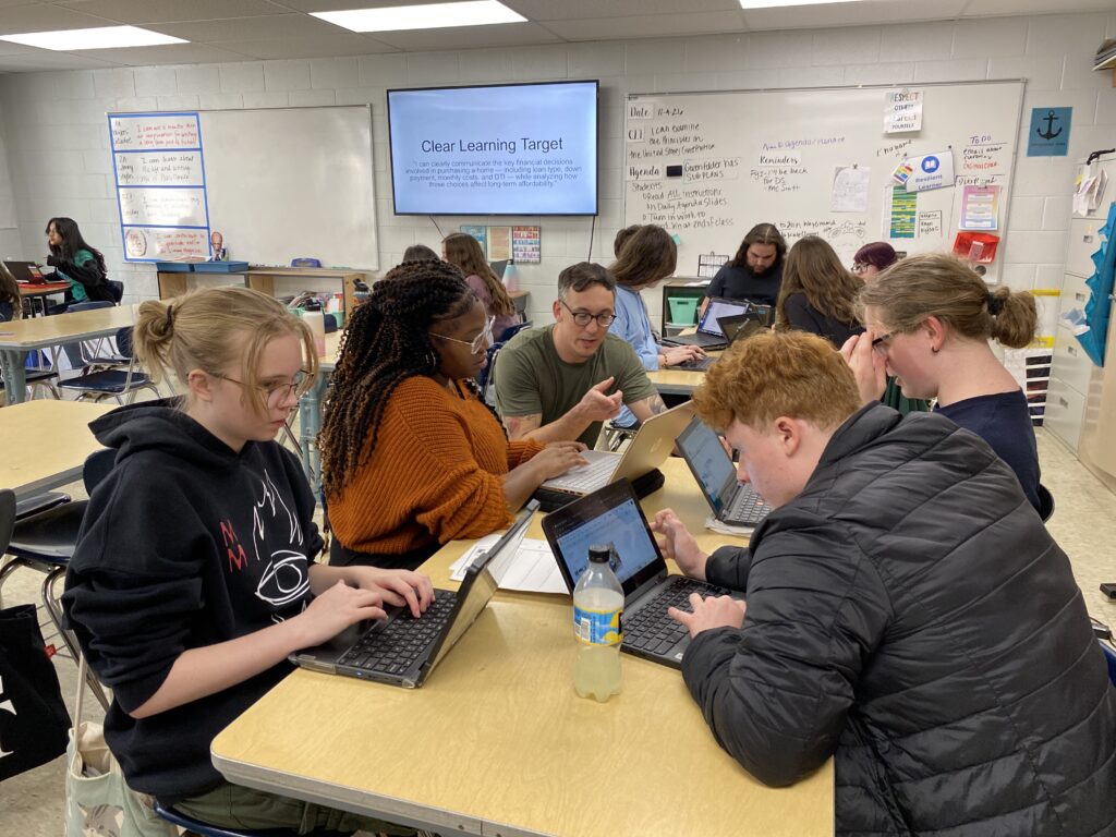 Students working in a classroom on laptops