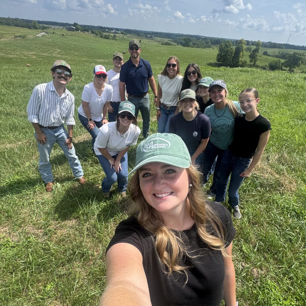 Callie Hudson in a field with people in the background