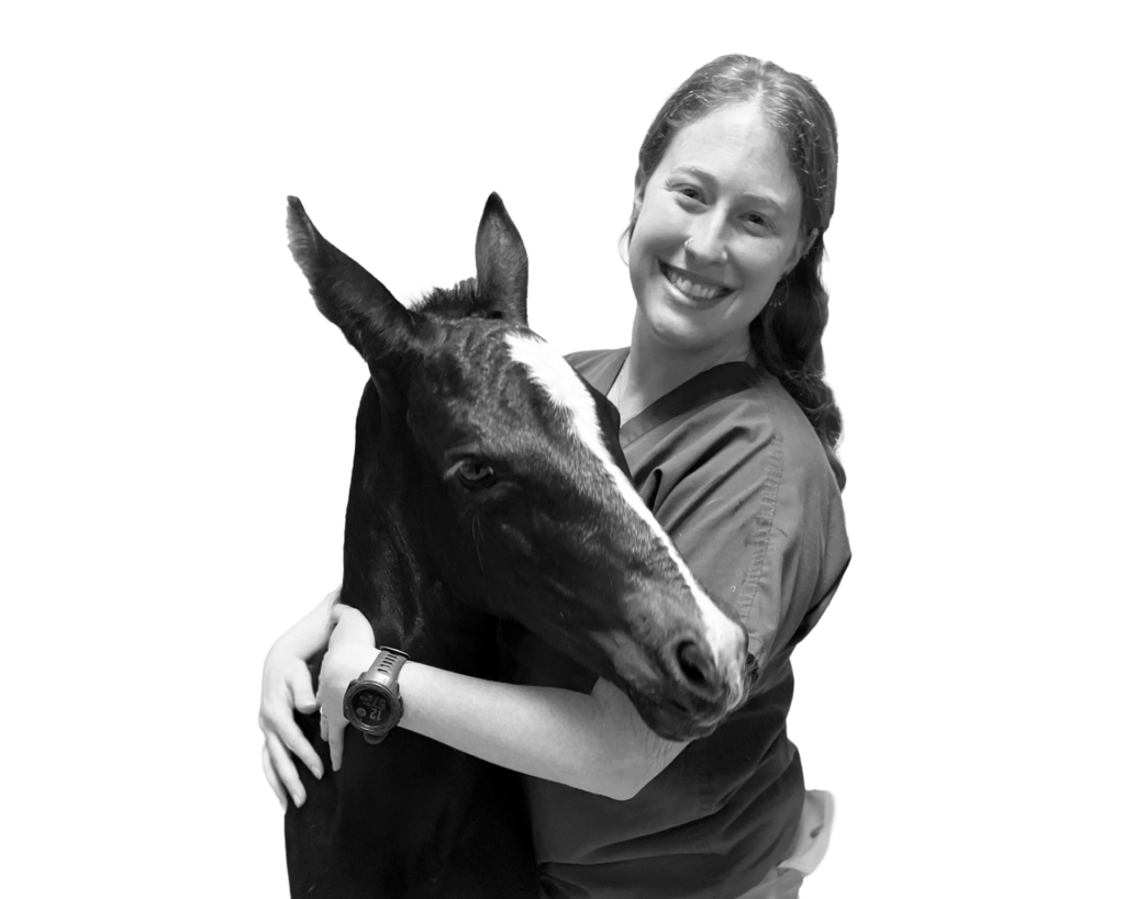 Caroline Griffin hugging a horse