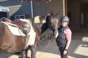 Caroline Griffin next to a horse