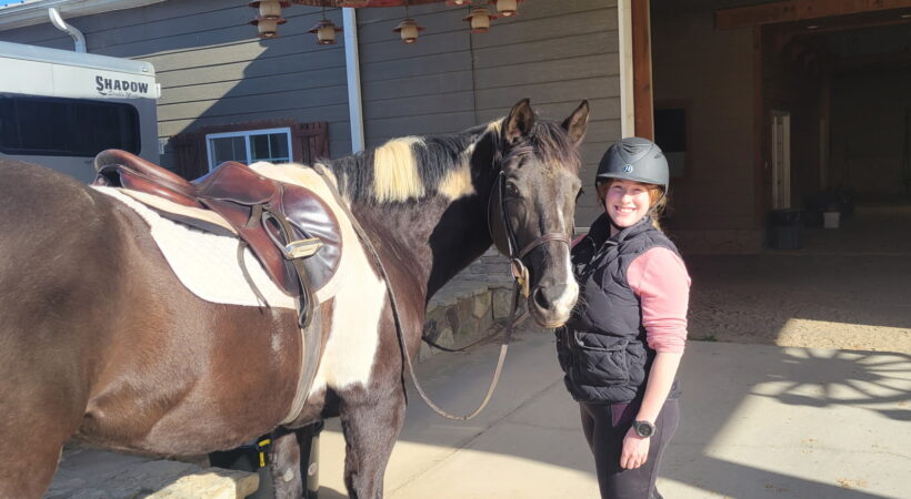 Caroline Griffin next to a horse